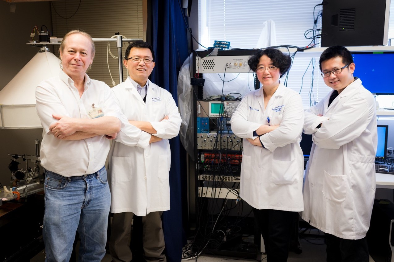 Four researchers in the lab